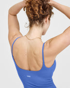 SoftMotion™ Strappy Mid Vest with Built in Bra Shelf with White Logo | Glaucous Blue