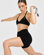 EnhanceLift™ Seamless Minimal Halter Neck Bralette with White Logo | Black