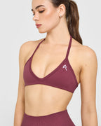 EnhanceLift™ Seamless Minimal Halter Neck Bralette with White Logo | Burnt Maroon