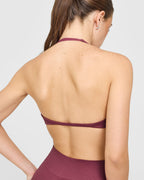 EnhanceLift™ Seamless Minimal Halter Neck Bralette with White Logo | Burnt Maroon