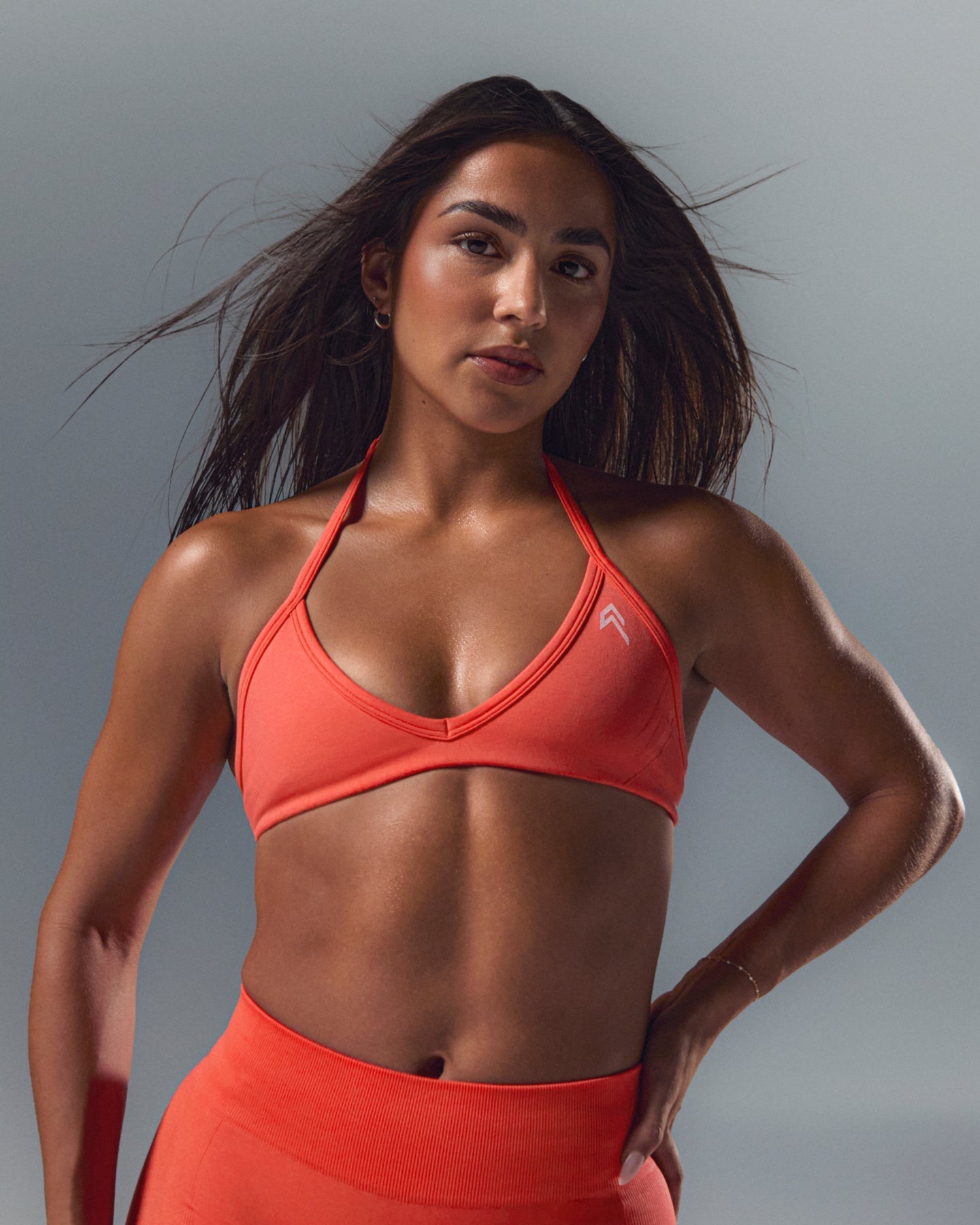 EnhanceLift™ Seamless Minimal Halter Neck Bralette with White Logo | Charged Coral