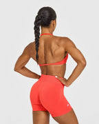 EnhanceLift™ Seamless Minimal Halter Neck Bralette with White Logo | Charged Coral