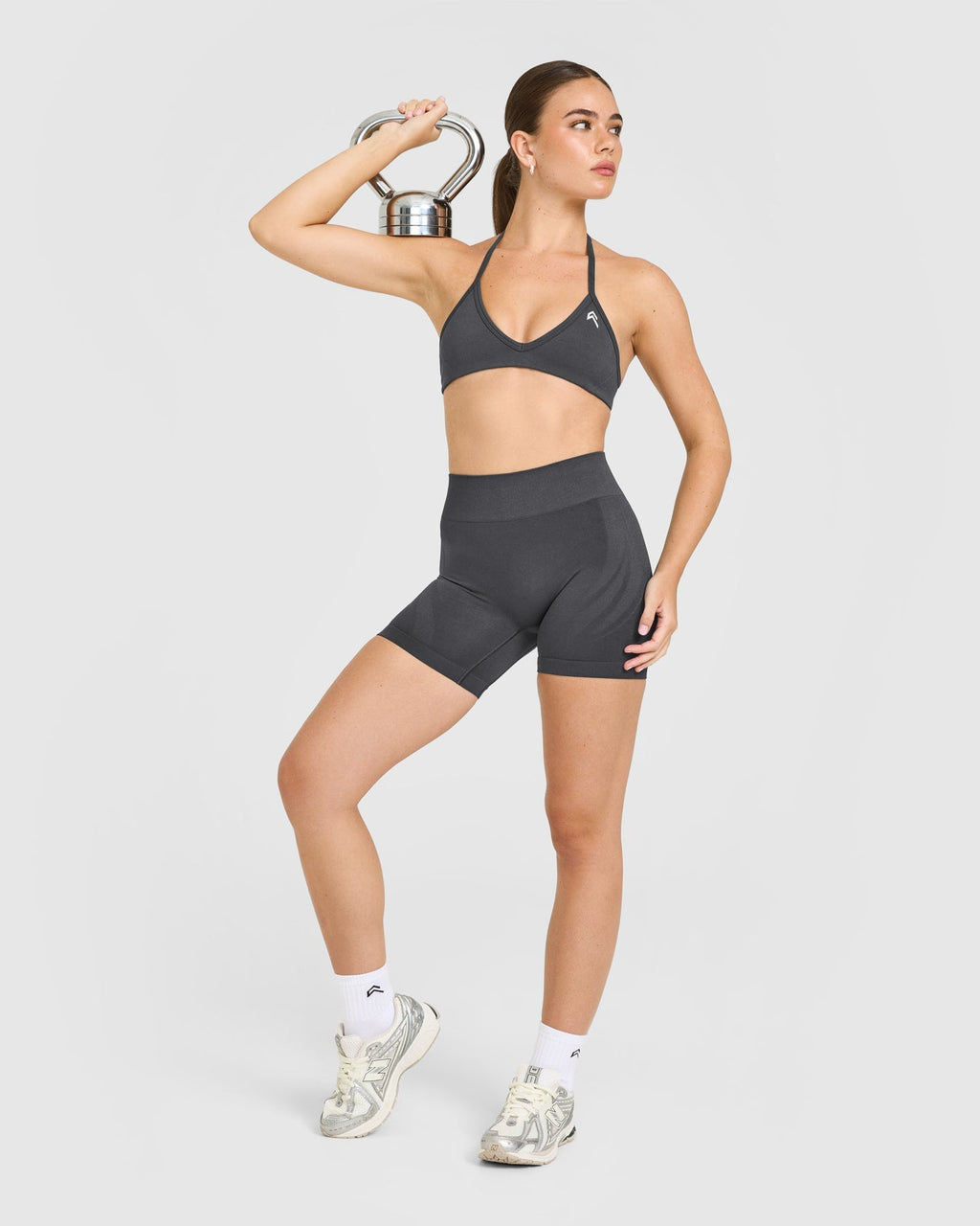 EnhanceLift™ Seamless Minimal Halter Neck Bralette with White Logo | Coal