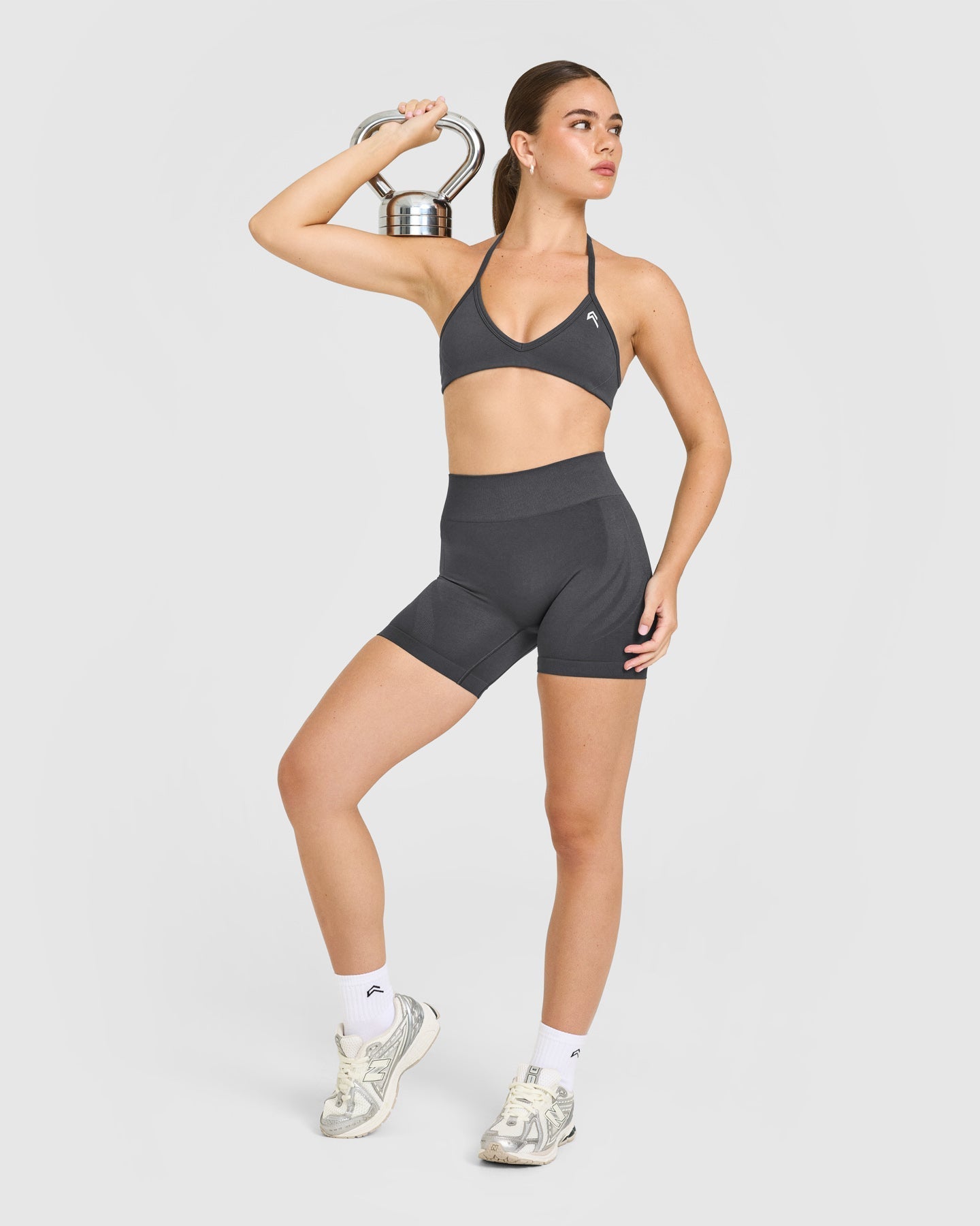 EnhanceLift™ Seamless Minimal Halter Neck Bralette with White Logo | Coal