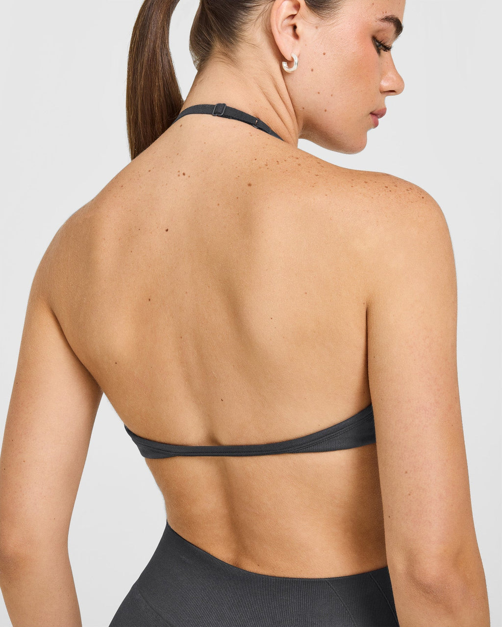 EnhanceLift™ Seamless Minimal Halter Neck Bralette with White Logo | Coal