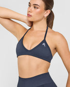 EnhanceLift™ Seamless Minimal Halter Neck Bralette with White Logo | True Blue