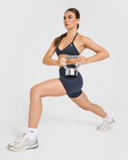 EnhanceLift™ Seamless Minimal Halter Neck Bralette with White Logo | True Blue