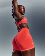 EnhanceLift™ Seamless Shorts with White Logo | Charged Coral