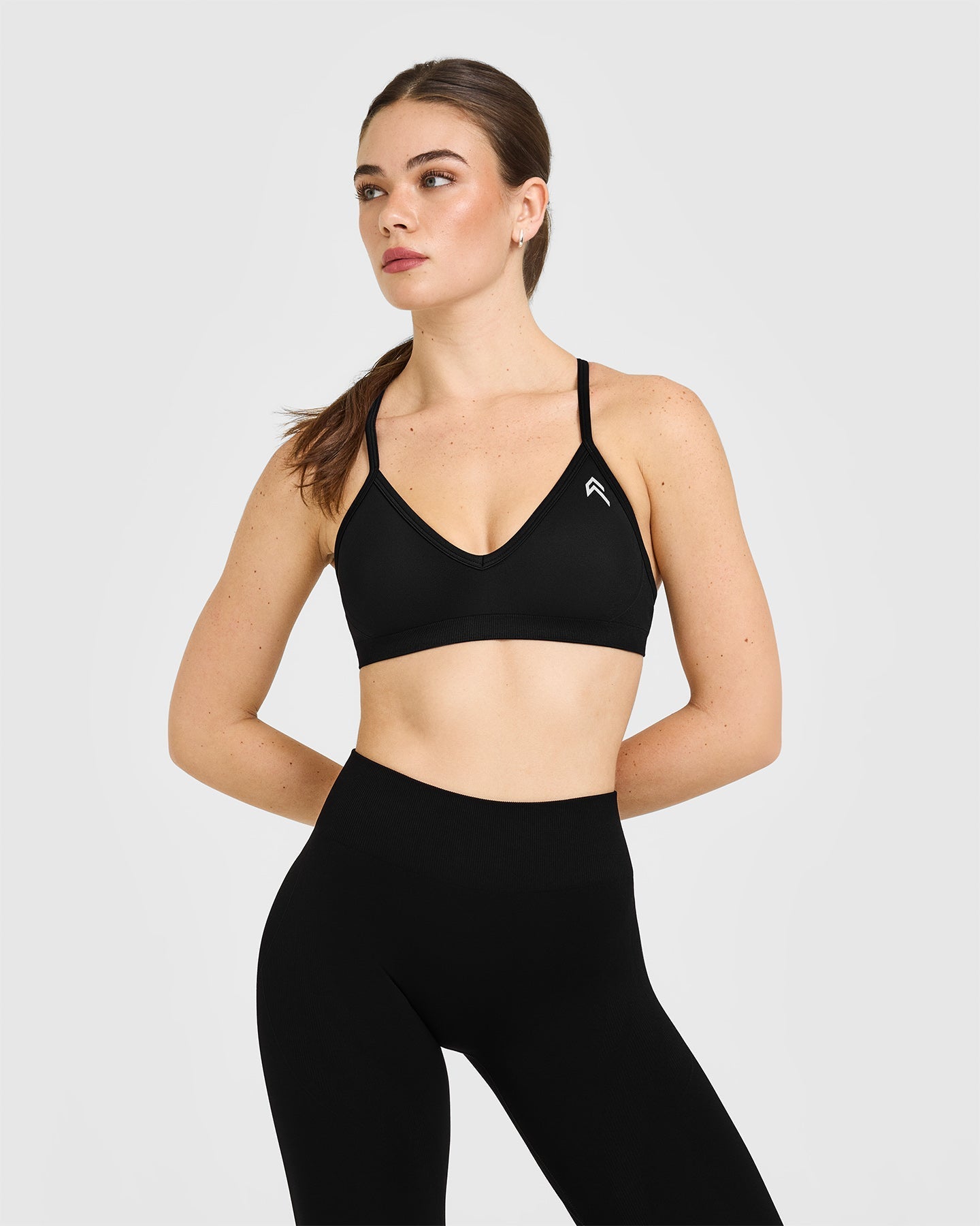 EnhanceLift™ Seamless Strappy Sports Bra with White Logo | Black