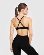 EnhanceLift™ Seamless Strappy Sports Bra with White Logo | Black