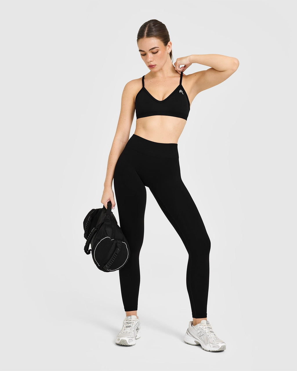 EnhanceLift™ Seamless Strappy Sports Bra with White Logo | Black