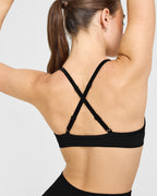 EnhanceLift™ Seamless Strappy Sports Bra with White Logo | Black