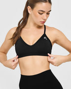 EnhanceLift™ Seamless Strappy Sports Bra with White Logo | Black