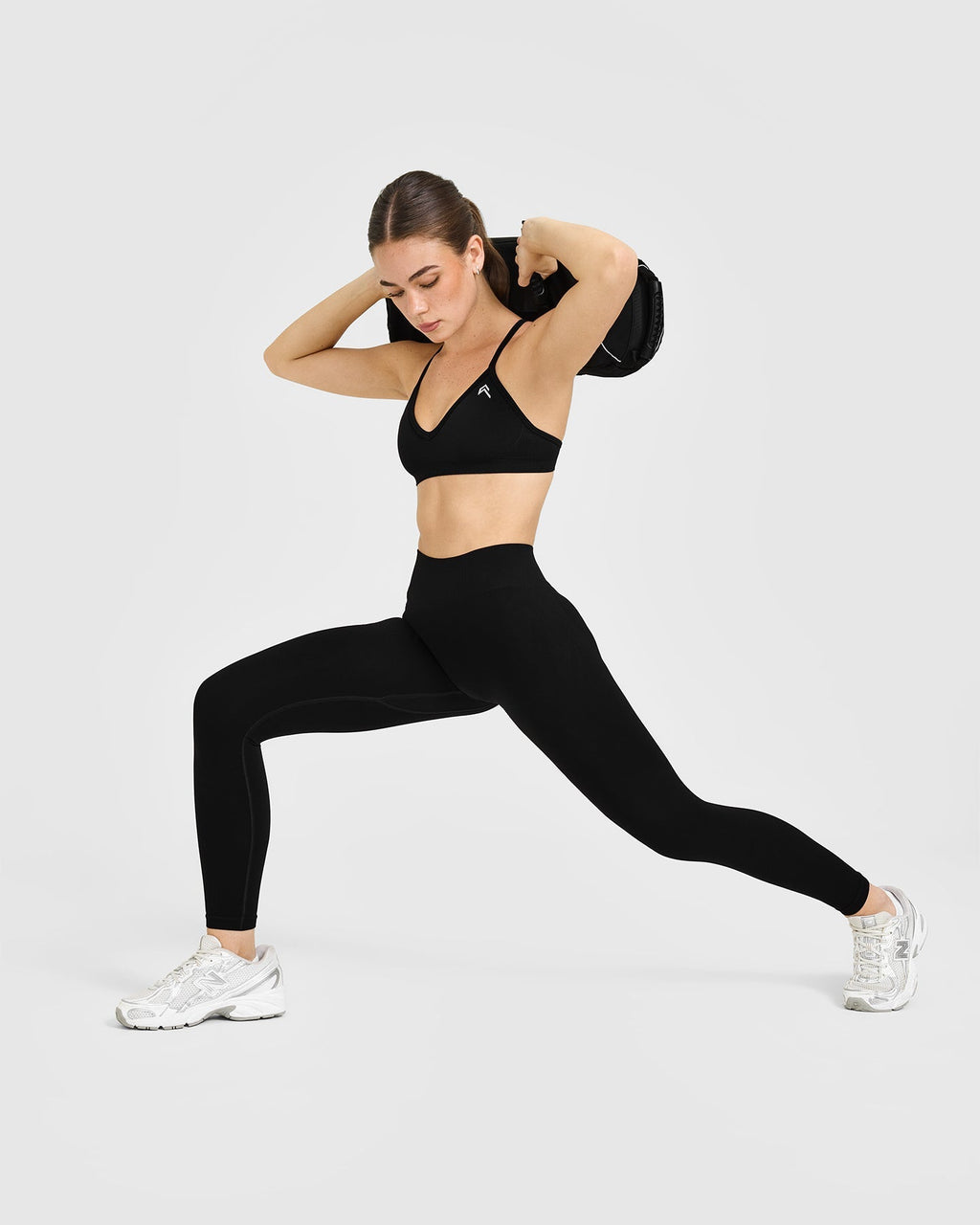 EnhanceLift™ Seamless Strappy Sports Bra with White Logo | Black