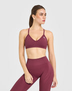 EnhanceLift™ Seamless Strappy Sports Bra with White Logo | Burnt Maroon