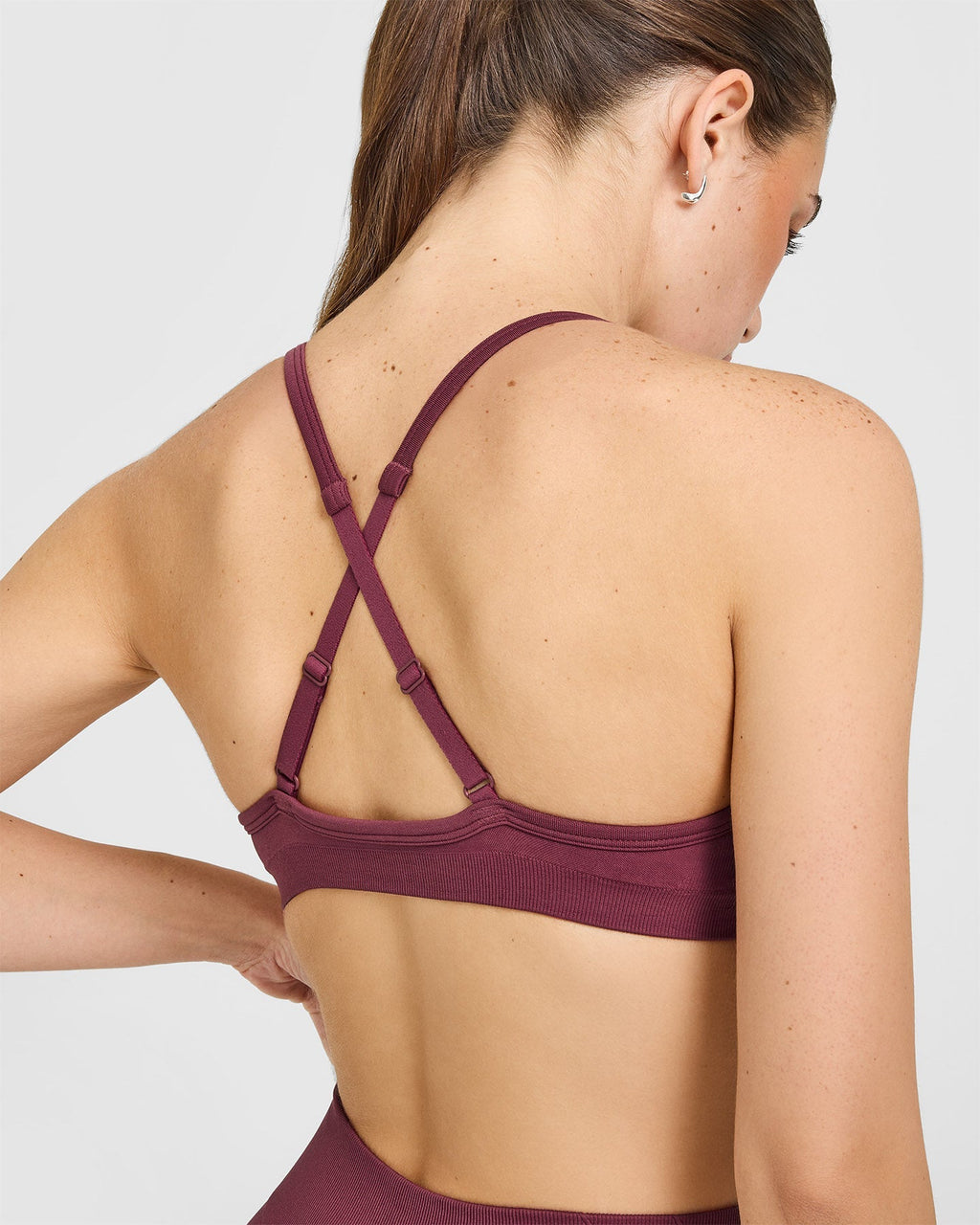 EnhanceLift™ Seamless Strappy Sports Bra with White Logo | Burnt Maroon