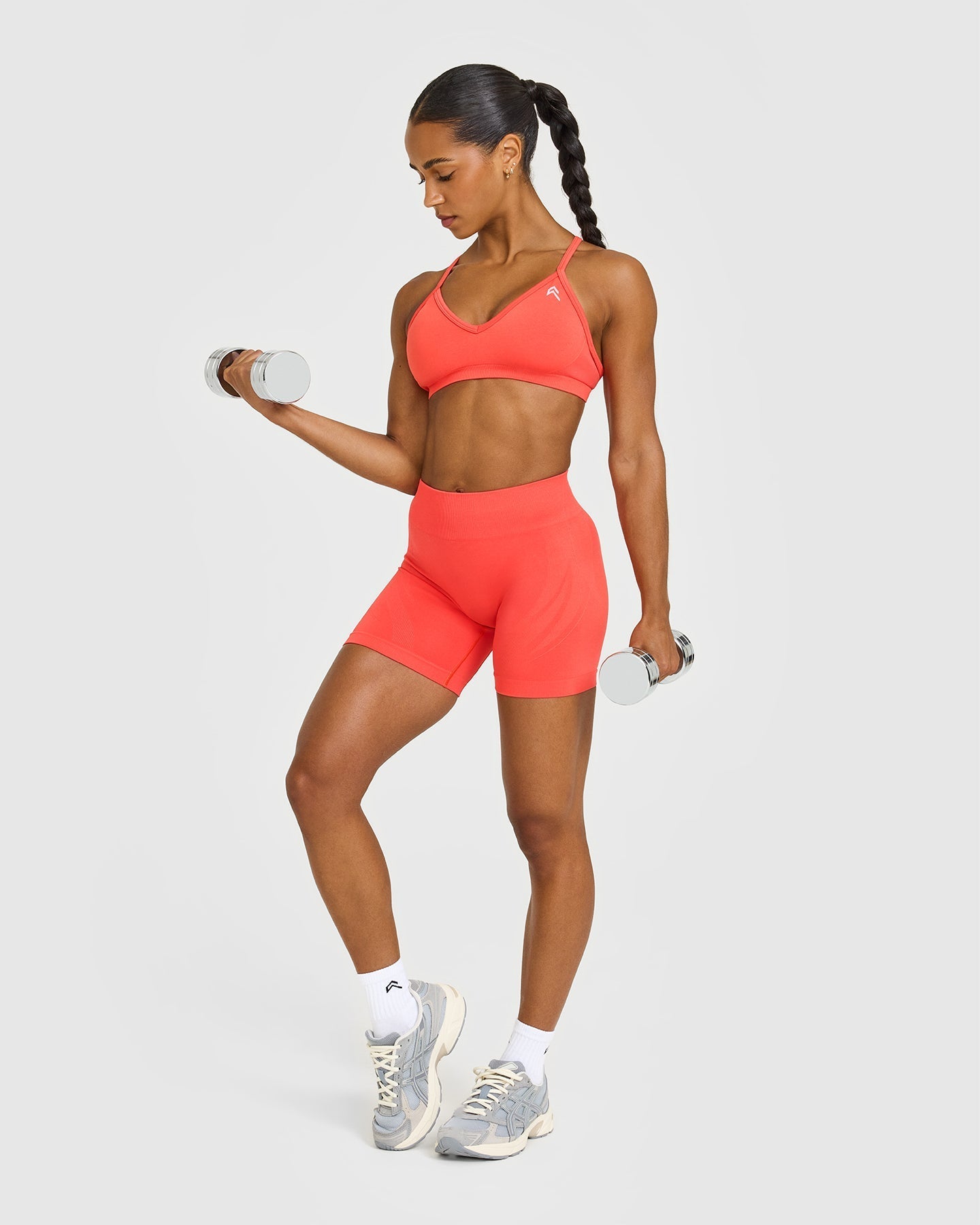 EnhanceLift™ Seamless Strappy Sports Bra with White Logo | Charged Coral