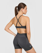 EnhanceLift™ Seamless Strappy Sports Bra with White Logo | Coal