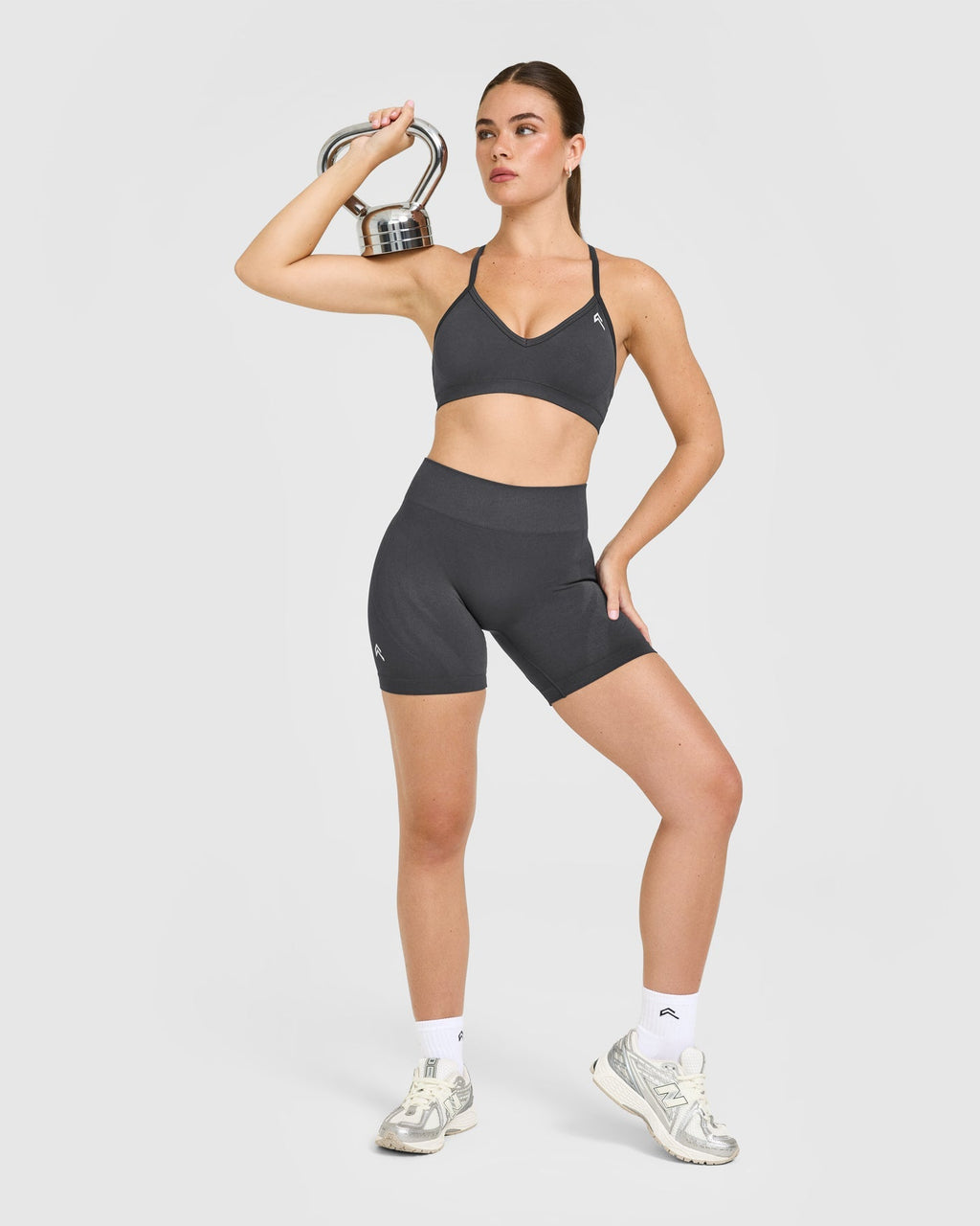 EnhanceLift™ Seamless Strappy Sports Bra with White Logo | Coal