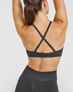 EnhanceLift™ Seamless Strappy Sports Bra with White Logo | Coal