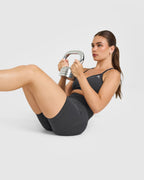 EnhanceLift™ Seamless Strappy Sports Bra with White Logo | Coal