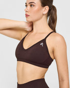 EnhanceLift™ Seamless Strappy Sports Bra with White Logo | Plum Brown