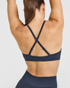 EnhanceLift™ Seamless Strappy Sports Bra with White Logo | True Blue