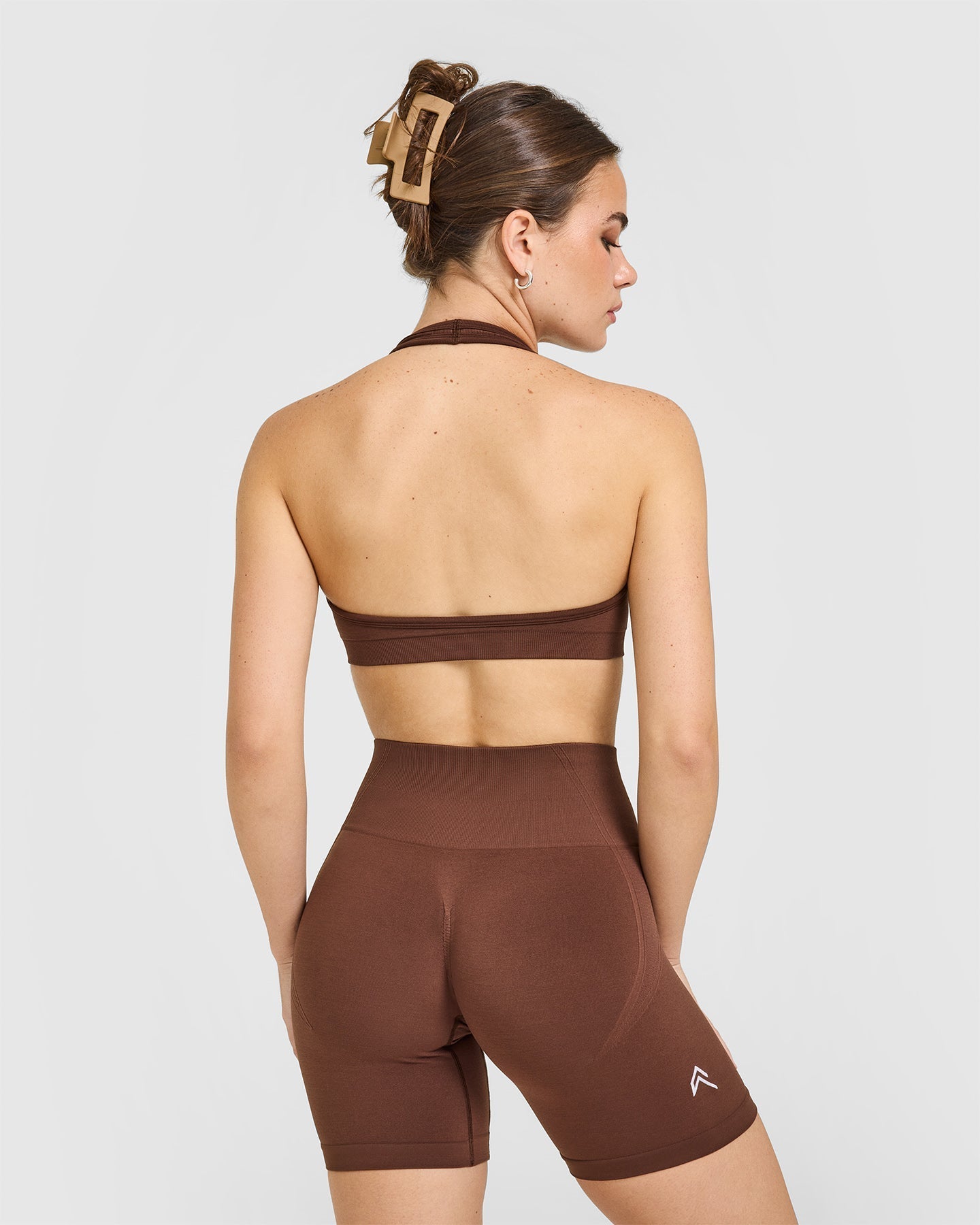 Effortless Seamless Halter Neck Sports Bra with White Logo | Rustic Brown