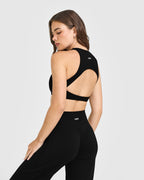 SoftMotion™ High Neck Sports Bra with White Logo | Black