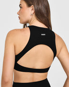 SoftMotion™ High Neck Sports Bra with White Logo | Black