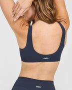 SoftMotion™ Scoop Back Bralette with White Logo | True Blue