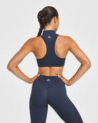 EasyLift™ Zip High Neck Sports Bra with White Logo | True Blue