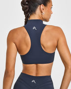 EasyLift™ Zip High Neck Sports Bra with White Logo | True Blue