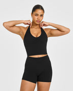 SoftMotion™ Halter Neck Mid Vest with Built in Bra Shelf with White Logo | Black