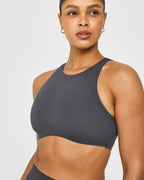 SoftMotion™ High Neck Sports Bra with White Logo | Coal