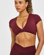 Unified Twist Front Short Sleeve Crop Top White Logo | Rosewood