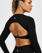Unified Twist Front Long Sleeve Crop Top White Logo | Black