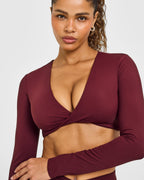Unified Twist Front Long Sleeve Crop Top White Logo | Rosewood