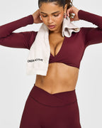Unified Twist Front Long Sleeve Crop Top White Logo | Rosewood