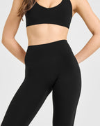 SoftMotion™ High Waisted Capri Leggings with White Logo | Black