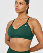 EnhanceLift™ Seamless Strappy Sports Bra with White Logo | Racing Green