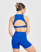 SoftMotion™ High Neck Sports Bra with White Logo | Light Cobalt Blue