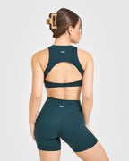 SoftMotion™ High Neck Sports Bra with White Logo | Oil Blue