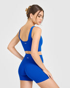 SoftMotion™ Longline Sports Bra with White Logo | Light Cobalt Blue