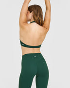SoftMotion™ Minimal Halter Neck Bralette with White Logo | Dark Racing Green