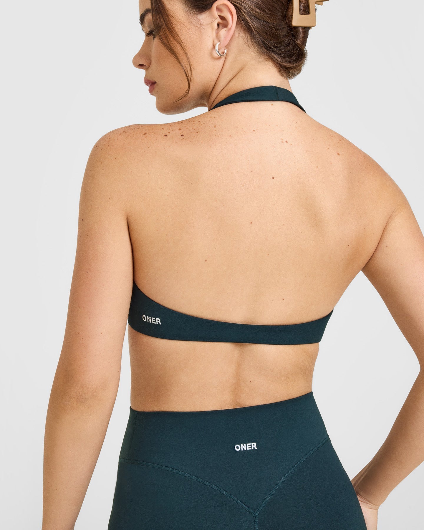 SoftMotion™ Minimal Halter Neck Bralette with White Logo | Oil Blue