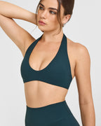 SoftMotion™ Minimal Halter Neck Bralette with White Logo | Oil Blue