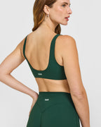 SoftMotion™ Scoop Back Bralette with White Logo | Dark Racing Green