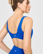 SoftMotion™ Scoop Back Bralette with White Logo | Light Cobalt Blue